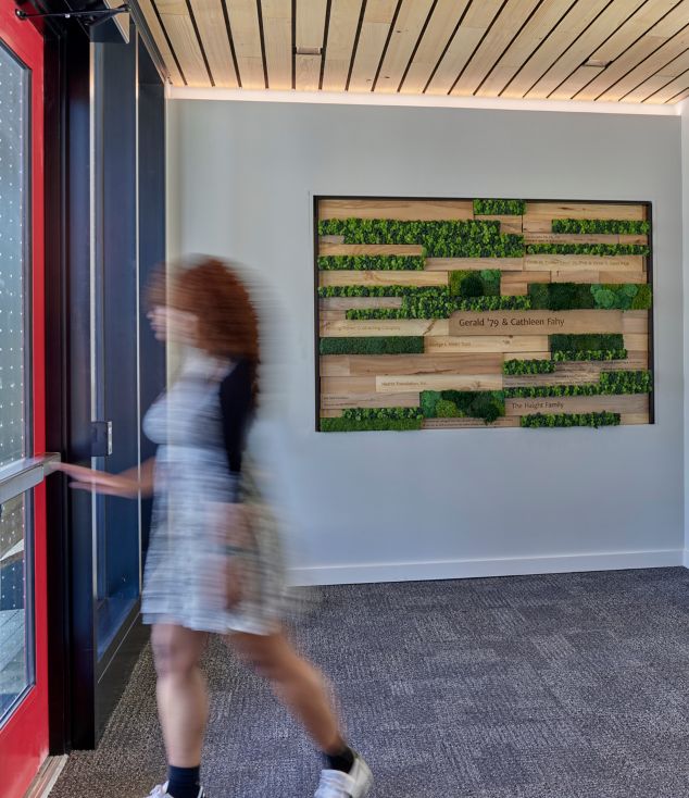 Interface SR999 carpet tile in entryway of college building with living wall
